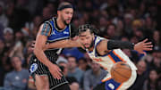 Dec 7, 2025; New York, New York, USA;  Orlando Magic guard Jalen Suggs (4) knocks the ball away from New York Knicks guard Jalen Brunson (11) in the fourth quarter at Madison Square Garden. Mandatory Credit: Wendell Cruz-Imagn Images