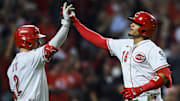 Sep 24, 2025; Cincinnati, Ohio, USA; Cincinnati Reds outfielder Noelvi Marte (16) high fives designated hitter Gavin Lux (2) after hitting an inside-the-park home run in the eighth inning against the Pittsburgh Pirates at Great American Ball Park. Mandatory Credit: Katie Stratman-Imagn Images