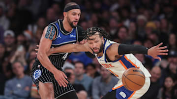 Dec 7, 2025; New York, New York, USA;  Orlando Magic guard Jalen Suggs (4) knocks the ball away from New York Knicks guard Jalen Brunson (11) in the fourth quarter at Madison Square Garden. Mandatory Credit: Wendell Cruz-Imagn Images