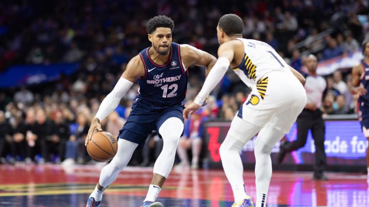 Nov 14, 2023; Philadelphia, Pennsylvania, USA; Philadelphia 76ers forward Tobias Harris (12) dribbles the ball against Indiana Pacers guard Tyrese Haliburton (0) during the first quarter at Wells Fargo Center. Mandatory Credit: Bill Streicher-USA TODAY Sports