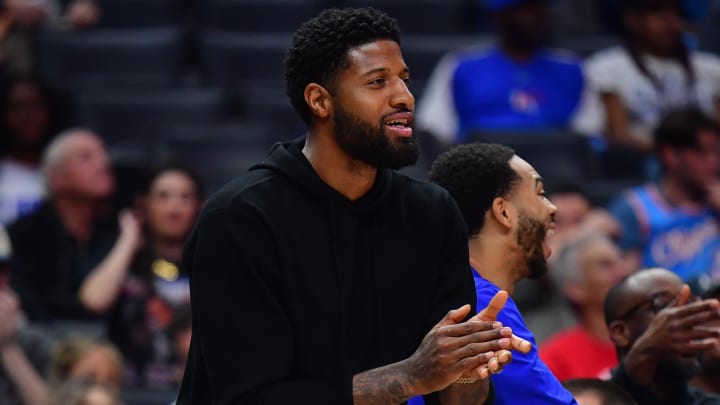 Apr 10, 2024; Los Angeles, California, USA; Los Angeles Clippers forward Paul George (13) watches game action against the Phoenix Suns during the second half at Crypto.com Arena. Mandatory Credit: Gary A. Vasquez-USA TODAY Sports