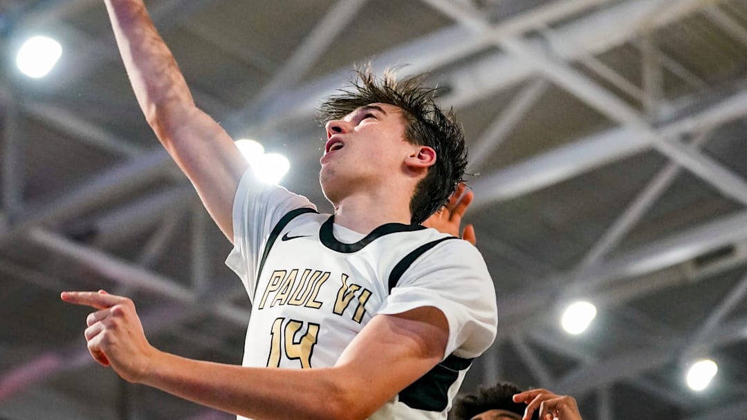 Paul VI Panthers forward Ryan Bahr (14) goes for a lay up during the third quarter of the City of Palms Classic first round game against the Garfield Heights Bulldogs at Suncoast Credit Union Arena in Fort Myers, Fla., on Thursday, Dec. 18, 2025.