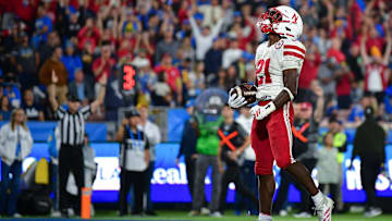 Nov 8, 2025; Pasadena, California, USA; Nebraska Cornhuskers running back Emmett Johnson (21) celebrates his touchdown scored against the UCLA Bruins during the first half at the Rose Bowl. Mandatory Credit: Gary A. Vasquez-Imagn Images