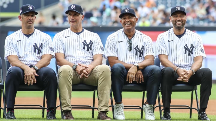 Sep 9, 2023; Bronx, New York, USA;  Members of the 1998 World Series New York Yankees team (from left to right), catcher Jorge Posada, pitchers Andy Pettitte and Mariano Rivera, and shortstop Derek Jeter before the game against the Milwaukee Brewers at Yankee Stadium. Mandatory Credit: Wendell Cruz-USA TODAY Sports