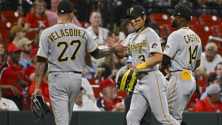 Pittsburgh Pirates center fielder Ji Hwan Bae (3) and pitcher Vince Velasquez (27)