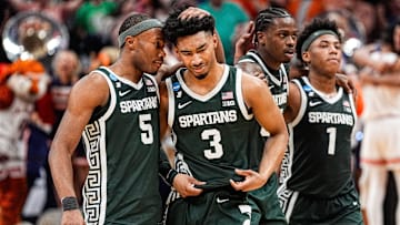 Michigan State guard Jaden Akins (3) is comforted by 
guard Tre Holloman (5) after 70-64 loss to Auburn at the Elite Eight round of NCAA tournament at State Farm Arena in Atlanta, Ga. on Sunday, March 30, 2025.