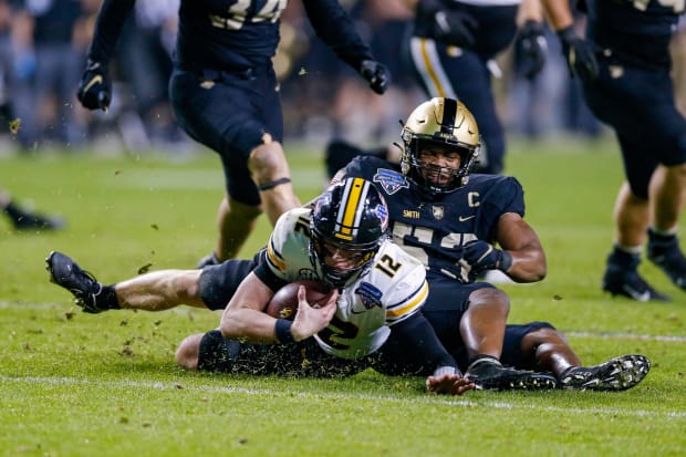 Army Black Knights linebacker Arik Smith (53) sacks Missouri Tigers quarterback Brady Cook (12) during the fourth quarter. 