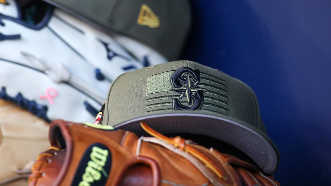 A detailed view of the Seattle Mariners Armed Forces Day hat in the dugout in 2023.