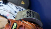 May 20, 2023; Atlanta, Georgia, USA; A detailed view of the Seattle Mariners armed forces day hat in the dugout against the Atlanta Braves in the first inning at Truist Park. Mandatory Credit: Brett Davis-Imagn Images