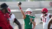 Louisville’s Miller Moss throws the ball during practice before the start of the 2025 football season.