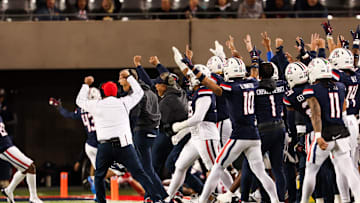 Nov 15, 2024; Tucson, Arizona, USA; Arizona Wildcats head coach Brent Brennan celebrates with Arizona Wildcats team during the second quarter against the Houston Cougars at Arizona Stadium. Mandatory Credit: Aryanna Frank-Imagn Images