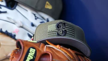 A detailed view of the Seattle Mariners Armed Forces Day hat in the dugout in 2023.