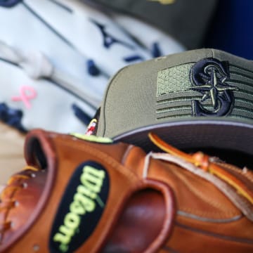 May 20, 2023; Atlanta, Georgia, USA; A detailed view of the Seattle Mariners armed forces day hat in the dugout against the Atlanta Braves in the first inning at Truist Park. Mandatory Credit: Brett Davis-USA TODAY Sports
