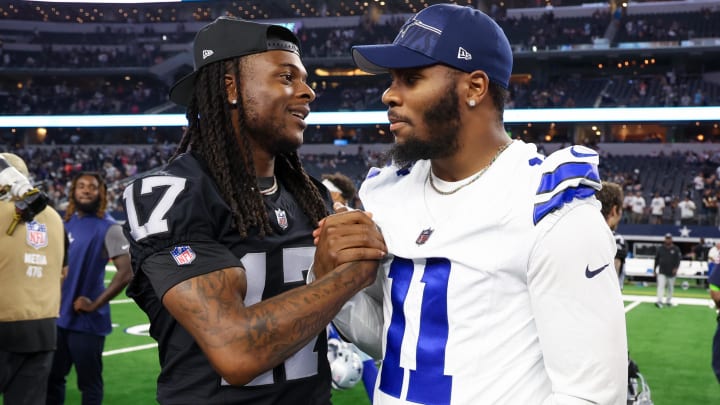 Aug 26, 2023; Arlington, Texas, USA;  Las Vegas Raiders wide receiver Davante Adams (17) greets Dallas Cowboys linebacker Micah Parsons (11)