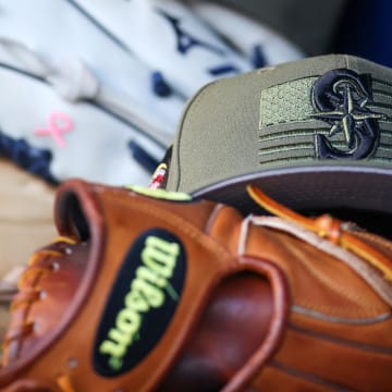 A detailed view of the Seattle Mariners armed forces day hat in the dugout against the Atlanta Braves in the first inning at Truist Park in 2023.