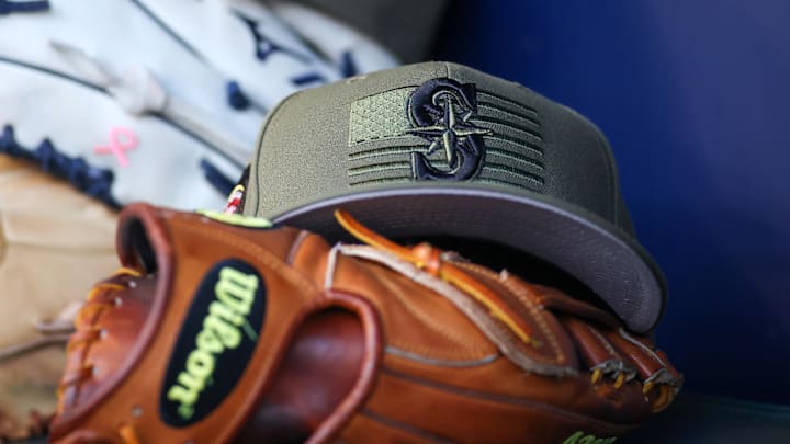 The Seattle Mariners armed forces day hat is pictured in the dugout before a game against the Atlanta Braves on May 20, 2023 at Truist Park.