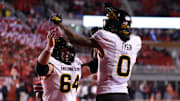 Oct 11, 2025; Salt Lake City, Utah, USA; Arizona State Sun Devils wide receiver Jordyn Tyson (0) celebrates scoring a touchdown against the Utah Utes with Arizona State Sun Devils offensive lineman Wade Helton (64) during the third quarter at Rice-Eccles Stadium. Mandatory Credit: Rob Gray-Imagn Images