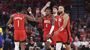 Apr 23, 2025; Houston, Texas, USA; Houston Rockets guard Jalen Green (4) and forward Amen Thompson (1) react after a play during the fourth quarter during game two of the first round for the 2024 NBA Playoffs against the Golden State Warriors at Toyota Center. Mandatory Credit: Troy Taormina-Imagn Images
