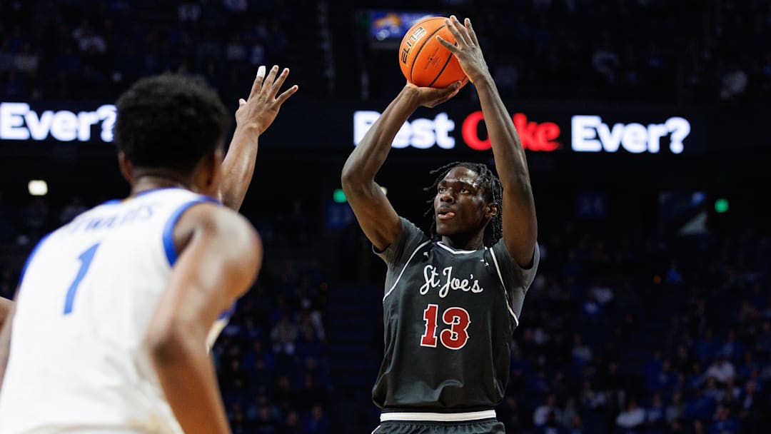 Nov 20, 2023; Lexington, Kentucky, USA; Saint Joseph's Hawks forward Rasheer Fleming (13) shoots the ball during the first half against the Kentucky Wildcats at Rupp Arena at Central Bank Center. Mandatory Credit: Jordan Prather-Imagn Images