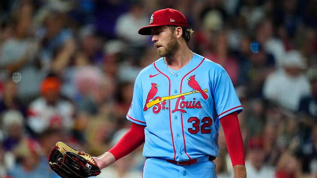 Sep 5, 2026; Denver, Colorado, USA;  St. Louis Cardinals pitcher Matthew Liberatore (32) reacts after a wild pitch scores a run for the Colorado Rockies during the fifth inning at Coors Field.  Mandatory Credit: Ron Chenoy-Imagn Images