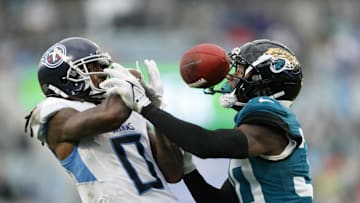 Dec 29, 2024; Jacksonville, Florida, USA;  Jacksonville Jaguars cornerback Montaric Brown (30) blocks Tennessee Titans wide receiver Calvin Ridley (0) from catching the ball in the endzone during the third quarter at EverBank Stadium. Mandatory Credit: Morgan Tencza-Imagn Images
