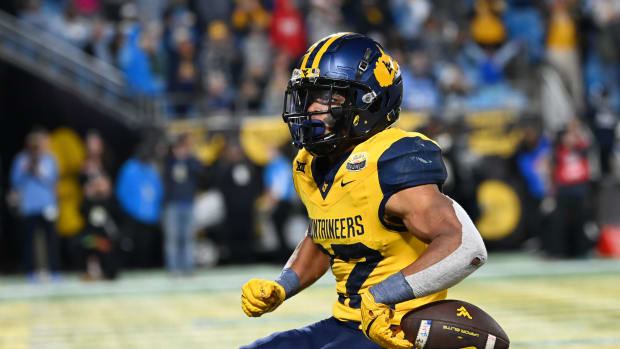 West Virginia Mountaineers running back Jahiem White (22) scores a touchdown. Bob Donnan-USA TODAY Sports