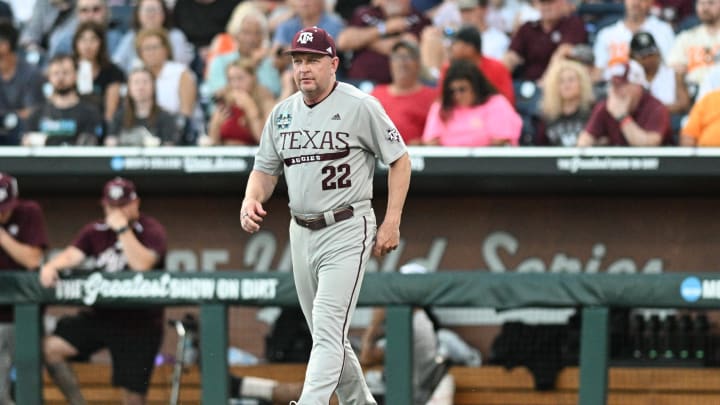 Jun 22, 2024; Omaha, NE, USA;  Texas A&M Aggies head coach Jim Schlossnagle walks to the mound against the Tennessee Volunteers during the fifth inning at Charles Schwab Field Omaha. Mandatory Credit: Steven Branscombe-USA TODAY Sports
