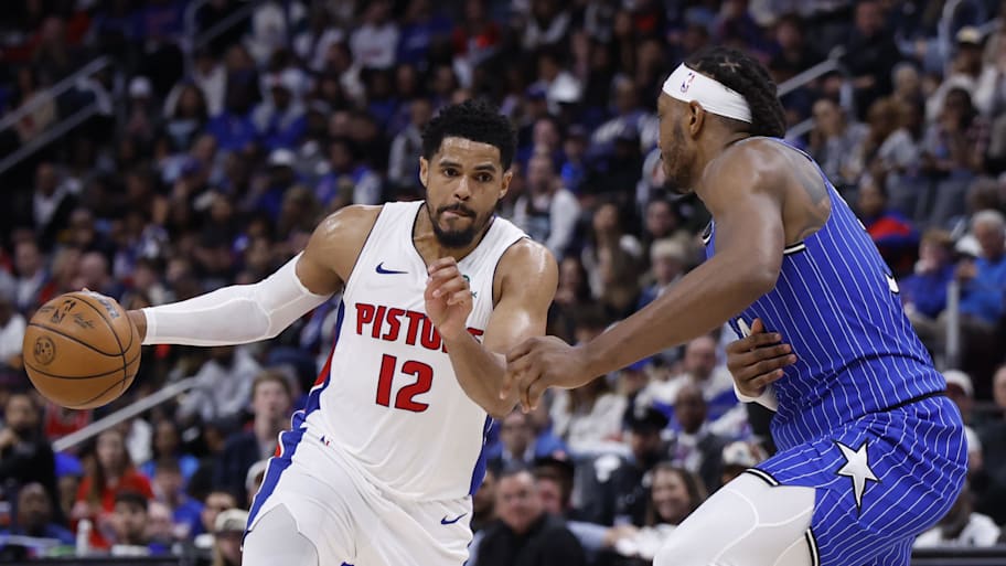 Detroit Pistons forward Tobias Harris dribbles defended by Orlando Magic center Wendell Carter Jr. 
