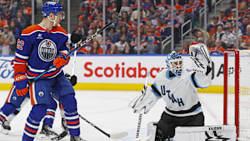 Mar 18, 2025; Edmonton, Alberta, CAN; Edmonton Oilers forward Vasily Podkolzin (92) watches a shot go wide of Utah Hockey Club goaltender Karel Vejmelka (70) during the third period at Rogers Place. Mandatory Credit: Perry Nelson-Imagn Images