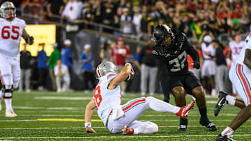Oct 12, 2024; Eugene, Oregon, USA; Ohio State Buckeyes quarterback Will Howard (18) slides down with no time left to end the game against the Oregon Ducks at Autzen Stadium.