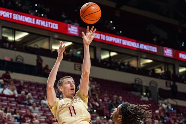 Florida State forward Christian Nitu (11) shoots for two against Virginia Tech Hokies.