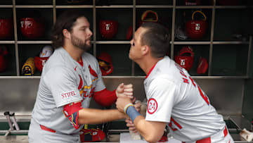 Jul 24, 2024; Pittsburgh, Pennsylvania, USA;  St. Louis Cardinals right fielder Alec Burleson (left) and left fielder Lars Nootbaar (21) perform a pre-game ritual before playing the Pittsburgh Pirates at PNC Park. Mandatory Credit: Charles LeClaire-Imagn Images