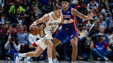 Nov 2, 2023; New Orleans, Louisiana, USA;  New Orleans Pelicans forward Matt Ryan (37) dribbles against Detroit Pistons guard Killian Hayes (7): Stephen Lew-Imagn Images