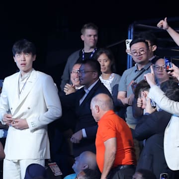 Jun 25, 2025; Brooklyn, NY, USA;  Yang Hansen walks to the stage after being selected as the 16th pick by the Memphis Grizzlies in the first round of the 2025 NBA Draft at Barclays Center. Mandatory Credit: Brad Penner-Imagn Images