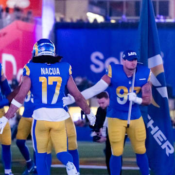 Jan 13, 2025; Glendale, AZ, USA; Los Angeles Rams wide receiver Puka Nacua (17) greets teammates prior to the game against the Minnesota Vikings in an NFC wild card game at State Farm Stadium. Mandatory Credit: Mark J. Rebilas-Imagn Images