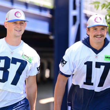 Jun 10, 2024; Foxborough, MA, USA; New England Patriots kicker Chad Ryland (37) and punter Bryce Baringer (17) walk to the practice fields for minicamp at Gillette Stadium. Mandatory Credit: Eric Canha-USA TODAY Sports