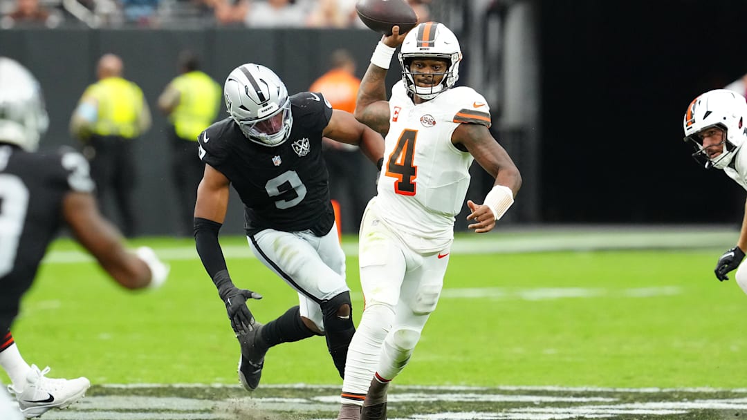 Sep 29, 2024; Paradise, Nevada, USA; Cleveland Browns quarterback Deshaun Watson (4) throws under pressure against Las Vegas Raiders defensive end Tyree Wilson (9) during the second quarter at Allegiant Stadium. Mandatory Credit: Stephen R. Sylvanie-Imagn Images