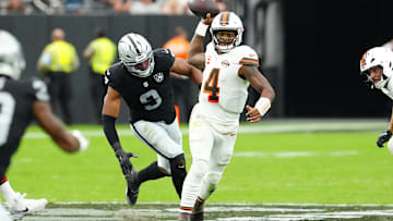 Sep 29, 2024; Paradise, Nevada, USA; Cleveland Browns quarterback Deshaun Watson (4) throws under pressure against Las Vegas Raiders defensive end Tyree Wilson (9) during the second quarter at Allegiant Stadium. Mandatory Credit: Stephen R. Sylvanie-Imagn Images