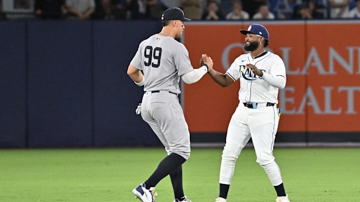 Aug 19, 2025; St. Petersburg, Florida, USA; Tampa Bay Rays third baseman Junior Caminero (13) and New York Yankees designated hitter Aaron Judge (99) talk before the start of their game at George M. Steinbrenner Field. Mandatory Credit: Jonathan Dyer-Imagn Images