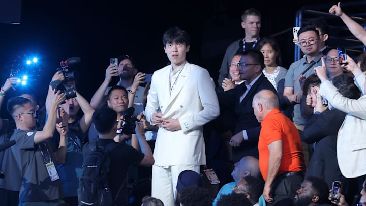 Jun 25, 2025; Brooklyn, NY, USA; Yang Hansen walks to the stage after being selected as the 16th pick by the Memphis Grizzlies in the first round of the 2025 NBA Draft at Barclays Center. Mandatory Credit: Brad Penner-Imagn Images Jun 25, 2025; Brooklyn, NY, USA; Yang Hansen walks to the stage after being selected as the 16th pick by the Memphis Grizzlies in the first round of the 2025 NBA Draft at Barclays Center. Mandatory Credit: Brad Penner-Imagn Images