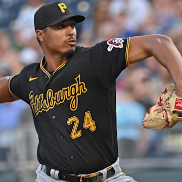 Aug 28, 2023; Kansas City, Missouri, USA;  Pittsburgh Pirates starting pitcher Johan Oviedo (24) delivers a pitch in the first inning against the Kansas City Royals at Kauffman Stadium. Mandatory Credit: Peter Aiken-Imagn Images