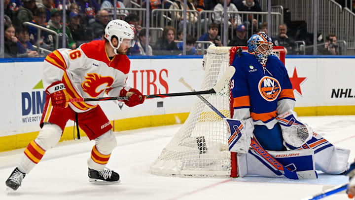 Mar 14, 2026; Elmont, New York, USA;  New York Islanders goaltender David Rittich (33) makes a save as aq6 looks for a rebound during the third period at UBS Arena. Mandatory Credit: Dennis Schneidler-Imagn Images