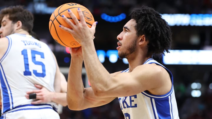 Mar 31, 2024; Dallas, TX, USA; Duke Blue Devils guard Jared McCain (0) shoots against the North Carolina State Wolfpack in the first half in the finals of the South Regional of the 2024 NCAA Tournament at American Airline Center. Mandatory Credit: Kevin Jairaj-USA TODAY Sports