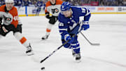 Jan 5, 2025; Toronto, Ontario, CAN; Toronto Maple Leafs forward Mitch Marner (16) carries the puck against the Philadelphia Flyers during the third period at Scotiabank Arena. Mandatory Credit: John E. Sokolowski-Imagn Images