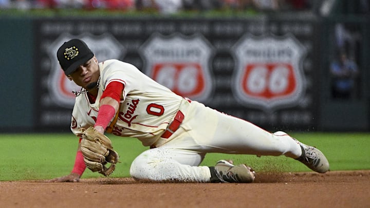 May 18, 2024; St. Louis, Missouri, USA;  St. Louis Cardinals shortstop Masyn Winn (0) dives for a ground ball against the Boston Red Sox during the eighth inning at Busch Stadium. Mandatory Credit: Jeff Curry-Imagn Images