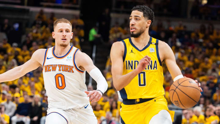 May 10, 2024; Indianapolis, Indiana, USA; Indiana Pacers guard Tyrese Haliburton (0) dribbles the ball while New York Knicks guard Donte DiVincenzo (0) defends during game three of the second round for the 2024 NBA playoffs at Gainbridge Fieldhouse. Mandatory Credit: Trevor Ruszkowski-USA TODAY Sports