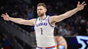 Mar 12, 2025; Kansas City, MO, USA; Kansas Jayhawks center Hunter Dickinson (1) reacts after a play during overtime against the UCF Knights at T-Mobile Center. 