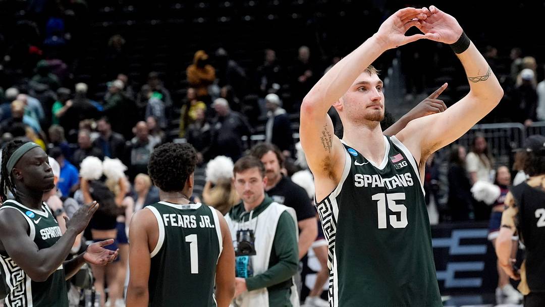 Michigan State center Carson Cooper (15) recognizes the State fans by making a heart with his hands at the end of the 2026 NCAA Men's Basketball East Regional game against UConn at Capital One Arena in Washington DC on Friday, March 27, 2026. 
Michigan State lost the game 67-63.