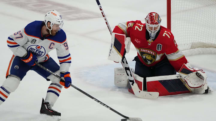 Jun 24, 2024; Sunrise, Florida, USA; Florida Panthers goaltender Sergei Bobrovsky (72) defends against Edmonton Oilers forward Connor McDavid (97) during the third period in game seven of the 2024 Stanley Cup Final at Amerant Bank Arena. Mandatory Credit: Jim Rassol-Imagn Images