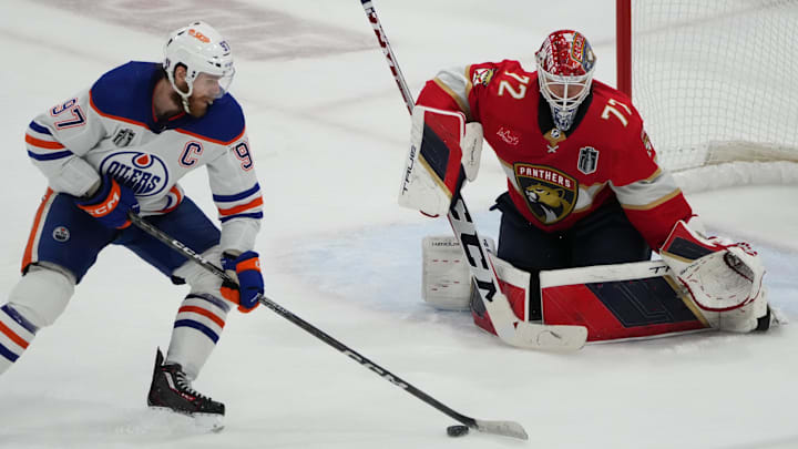 Jun 24, 2024; Sunrise, Florida, USA; Florida Panthers goaltender Sergei Bobrovsky (72) defends against Edmonton Oilers forward Connor McDavid (97) during the third period in game seven of the 2024 Stanley Cup Final at Amerant Bank Arena. Mandatory Credit: Jim Rassol-Imagn Images